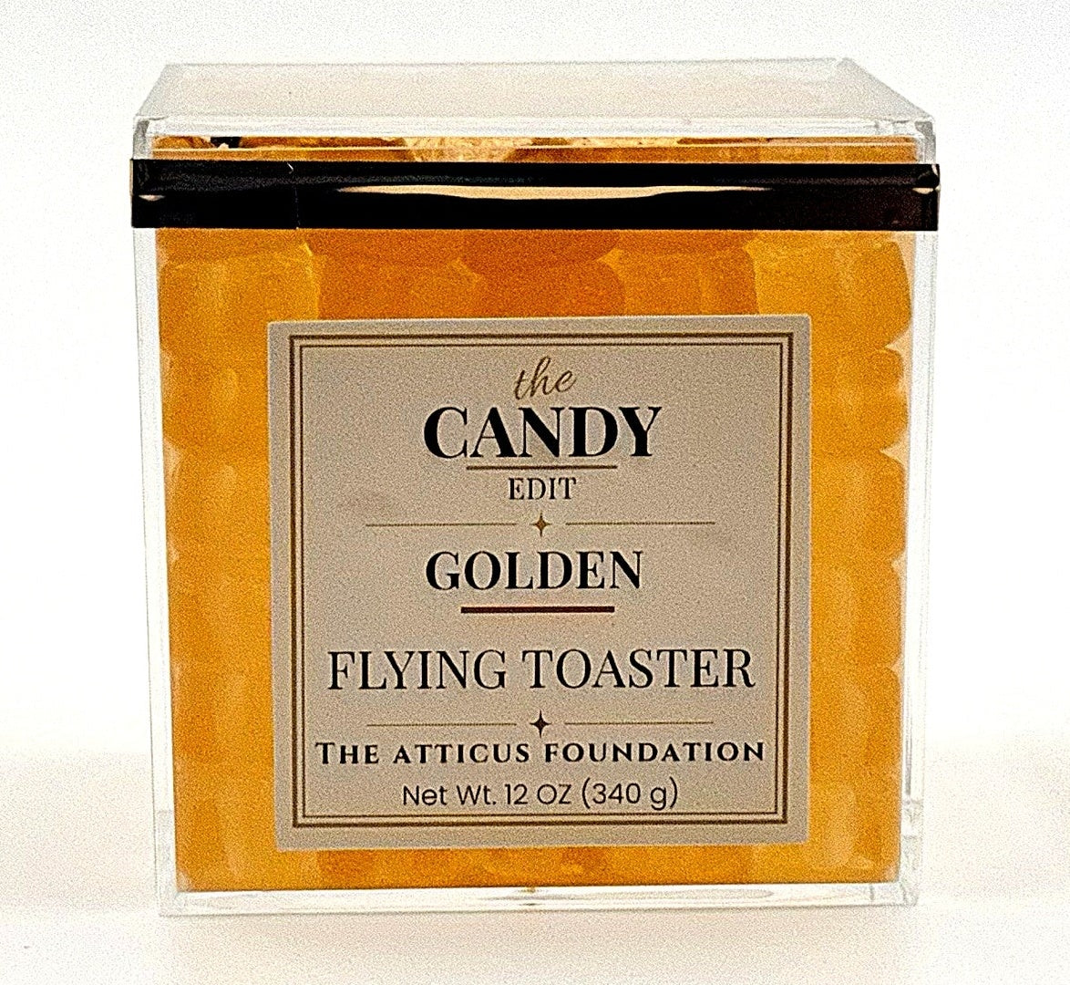 The Candy Edit Golden Flying Toaster candy cube, front view with pineapple gummy layers