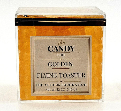 The Candy Edit Golden Flying Toaster candy cube, front view with pineapple gummy layers