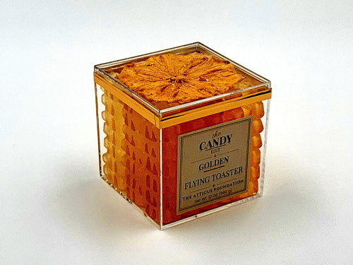 The Candy Edit Golden Flying Toaster candy cube, angled view showing gold-dusted pineapple top and gummy layers