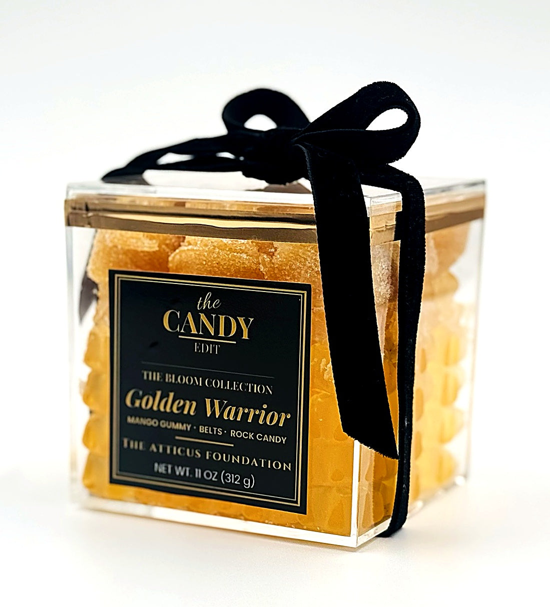 The Candy Edit Golden Warrior candy cube, angled view showing mango gummy and belt layers