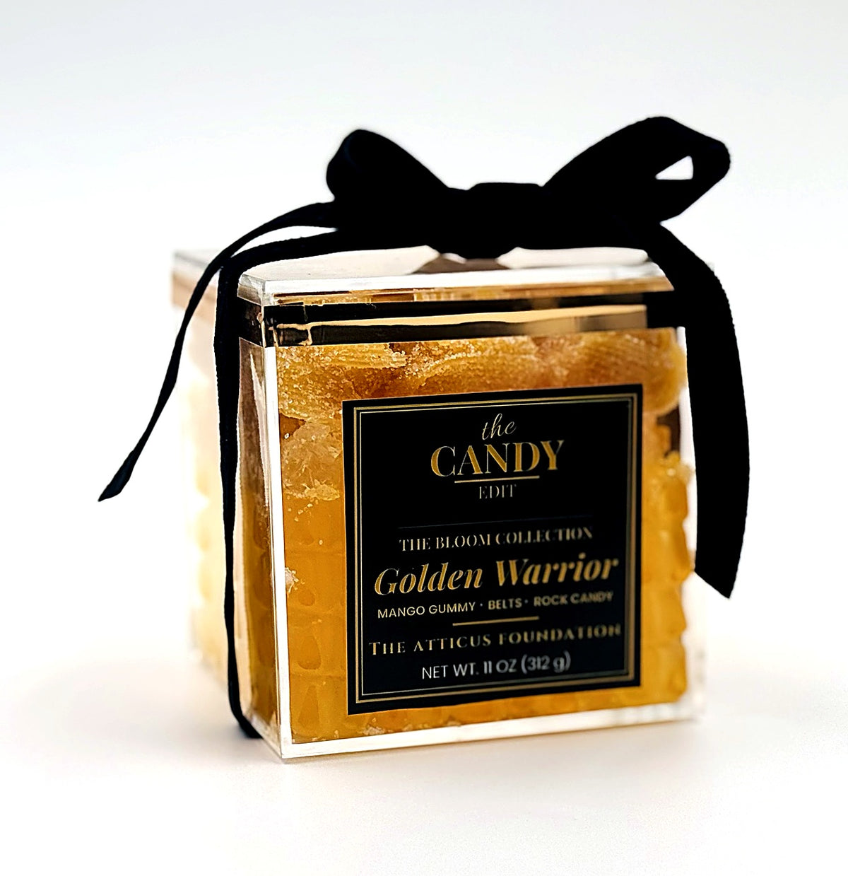 The Candy Edit Golden Warrior candy cube, close-up detail with black velvet ribbon bow